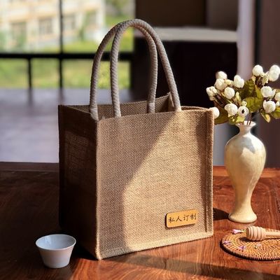 Umweltfreundliche Jute-Einkaufstaschen mit individuell gedrucktem Logo und Ledergriffe